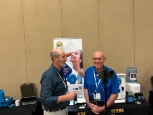 ACT D’MAND Kontrols ® Systems CTO and founder Larry Acker chatting with Robby Schwarts at EEBA 2022 High-Performance Home Summit